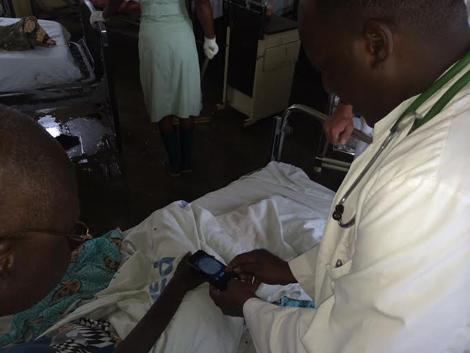 Health professional uses First Derm and iDoc24 dermascope to triage patient in Tanzania